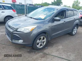 2013 Ford Escape SE with VIN 1FMCU9G95DUC01185, listed as a IAAI auction lot 42602840 with 140,697 mi miles and . Bid and sale history available at DreamBid. Image 2.