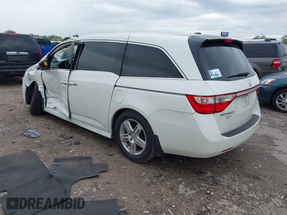 2013 Honda Odyssey Touring with VIN 5FNRL5H96DB074819, listed as a IAAI auction lot 41898358 with 123,428 mi miles and . Bid and sale history available at carsss.com. Image 3.