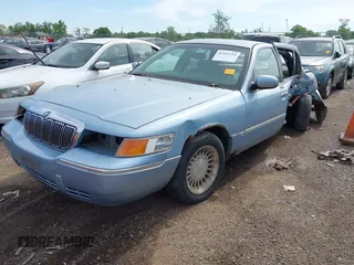 2000 Mercury Grand Marquis LS z VIN 2MEFM75W2YX740018, wystawiony jako IAAI lot #42255754 z przebiegiem 318 651 mil mil oraz . Historia ofert i sprzedaży dostępna na DreamBid. Obrazek 2.