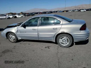 1999 Pontiac Grand Am SE2 with VIN 1G2NE52E5XM826878, listed as a Copart auction lot 77351164 with 241,463 mi miles and Salvage Title. Bid and sale history available at carsss.com. Image 2.