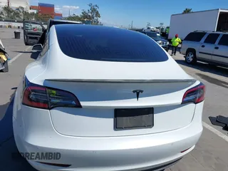 2019 Tesla Model 3 Mid Range with VIN 5YJ3E1EA5KF327181, listed as a IAAI auction lot 41860943 with 157,335 mi miles and . Bid and sale history available at DreamBid. Image 16.