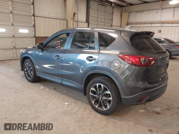 2016 Mazda CX-5 Grand Touring with VIN JM3KE2DYXG0846787, listed as a IAAI auction lot 41346364 with 113,553 mi miles. Bid and sale history available at carsss.com. Image 3.