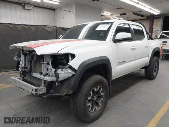 2022 Toyota Tacoma SR with VIN 3TMCZ5AN5NM480311, listed as a IAAI auction lot 42542600 with 43,297 mi miles and . Bid and sale history available at DreamBid. Image 2.