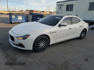 2014 Maserati Ghibli z VIN ZAM57XSA6E1097525, wystawiony jako Copart lot #42029695 z przebiegiem 93 740 mil mil oraz Szkody całkowita. Historia ofert i sprzedaży dostępna na DreamBid. Obrazek 1.