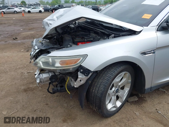 2012 Ford Taurus SEL z VIN 1FAHP2EW1CG132855, wystawiony jako IAAI lot #42256022 z przebiegiem 177 749 mil mil oraz . Historia ofert i sprzedaży dostępna na DreamBid. Obrazek 6.