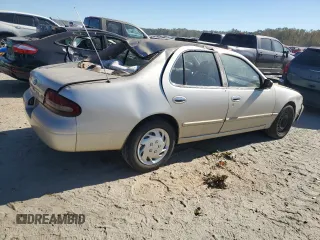 1996 Nissan Altima XE z VIN 1N4BU31D5TC104895, wystawiony jako Copart lot #77043684 z przebiegiem 133 113 mil mil oraz Szkoda całkowita • Salvage title. Historia ofert i sprzedaży dostępna na DreamBid. Obrazek 3.