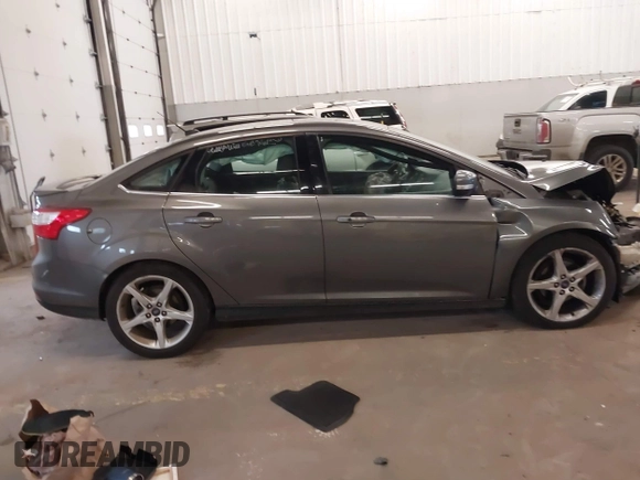 2013 Ford Focus Titanium with VIN 1FADP3J23DL265049, listed as a IAAI auction lot 41765621 with 100,550 mi miles and . Bid and sale history available at carsss.com. Image 13.
