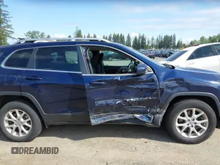 2015 Jeep Cherokee Latitude with VIN 1C4PJMCB0FW702535, listed as a IAAI auction lot 42149898 with 125,938 mi miles and . Bid and sale history available at carsss.com. Image 13.