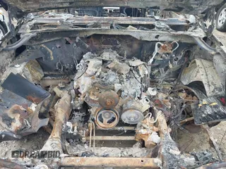 2005 Cadillac Escalade z VIN 1GYEC63N45R217863, wystawiony jako IAAI lot #41913229 z przebiegiem Nie podano mil oraz . Historia ofert i sprzedaży dostępna na DreamBid. Obrazek 10.