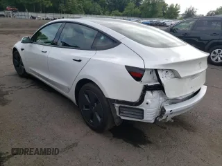 2023 Tesla Model 3 with VIN 5YJ3E1EA6PF563331, listed as a Copart auction lot 61124715 with 26,198 mi miles and Salvage title. Bid and sale history available at DreamBid. Image 2.