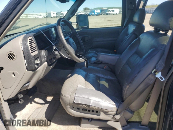 1999 Chevrolet Suburban with VIN 1GNEC16R1XJ394144, listed as a Copart auction lot 50418185 with 173,037 mi miles and Salvage title. Bid and sale history available at DreamBid. Image 7.
