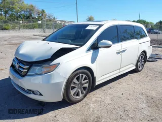 2015 Honda Odyssey Touring Elite with VIN 5FNRL5H96FB090702, listed as a IAAI auction lot 41825889 with 118,157 mi miles and . Bid and sale history available at DreamBid. Image 2.