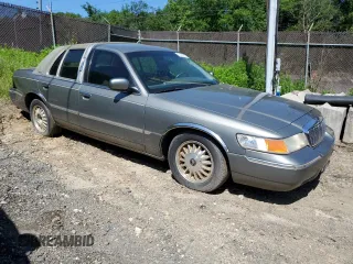 2000 Mercury Grand Marquis LS z VIN 2MEFM75W7YX694301, wystawiony jako Copart lot #57225295 z przebiegiem 141 420 mil mil oraz Szkoda całkowita • Salvage title. Historia ofert i sprzedaży dostępna na DreamBid. Obrazek 4.