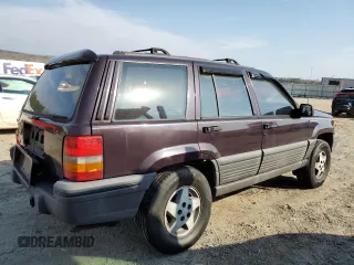 1993 Jeep Grand Cherokee Laredo with VIN 1J4GZ58S8PC656490, listed as a Copart auction lot 49377485 with 236,215 mi miles and Salvage Title. Bid and sale history available at carsss.com. Image 3.
