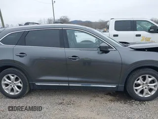 2016 Mazda CX-9 Grand Touring with VIN JM3TCBDY1G0103560, listed as a IAAI auction lot 41344813 with 123,588 mi miles and . Bid and sale history available at DreamBid. Image 13.