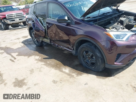 2016 Toyota RAV4 LE with VIN 2T3ZFREV8GW310580, listed as a IAAI auction lot 42063071 with 104,099 mi miles and . Bid and sale history available at DreamBid. Image 6.