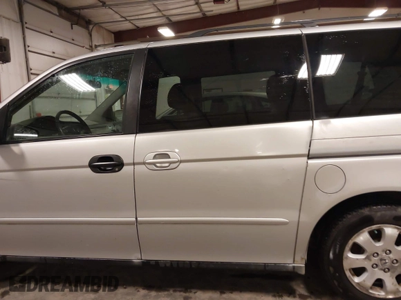 2004 Honda Odyssey EX-L with VIN 5FNRL18974B127696, listed as a IAAI auction lot 41643243 with 200,286 mi miles and . Bid and sale history available at DreamBid. Image 15.