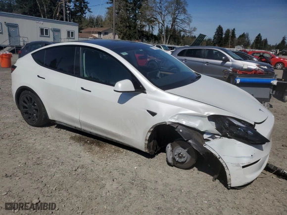 2023 Tesla Model Y Long Range with VIN 7SAYGDEE3PF751019, listed as a Copart auction lot 52716005 with 24,591 mi miles and Salvage Title. Bid and sale history available at carsss.com. Image 4.