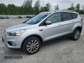2018 Ford Escape Titanium with VIN 1FMCU9J94JUA18798, listed as a Copart auction lot 63441885 with 85,500 mi miles and Salvage title. Bid and sale history available at DreamBid. Image 1.