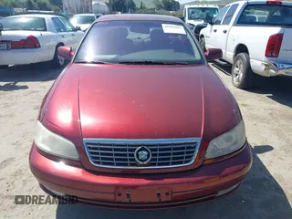 2001 Cadillac Catera z VIN W06VR54R01R003061, wystawiony jako IAAI lot #41989882 z przebiegiem 77 248 mil mil oraz . Historia ofert i sprzedaży dostępna na DreamBid. Obrazek 6.