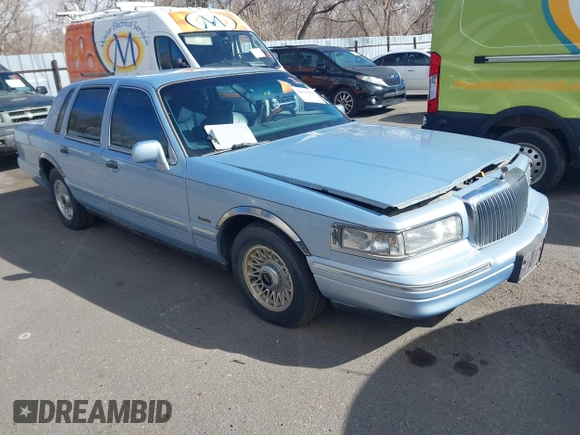1997 Lincoln Town Car Executive z VIN 1LNLM81W4VY750458, wystawiony jako IAAI lot #41656839 z przebiegiem 150 569 mil mil oraz . Historia ofert i sprzedaży dostępna na DreamBid. Obrazek 1.