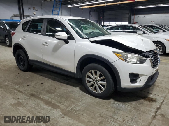 2016 Mazda CX-5 Sport with VIN JM3KE4BY9G0694709, listed as a Copart auction lot 55147555 with 98,900 mi miles and Salvage title. Bid and sale history available at DreamBid. Image 4.