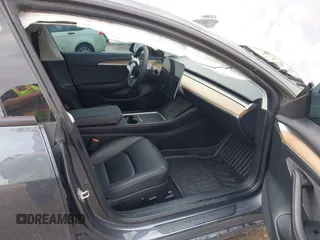 2023 Tesla Model 3 with VIN 5YJ3E1EA5PF676316, listed as a IAAI auction lot 42384765 with 33,715 mi miles and . Bid and sale history available at DreamBid. Image 5.