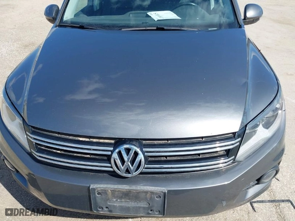 2012 Volkswagen Tiguan SE w/Sunroof & Nav with VIN WVGBV7AX4CW000207, listed as a IAAI auction lot 41889815 with 138,669 mi miles. Bid and sale history available at carsss.com. Image 6.