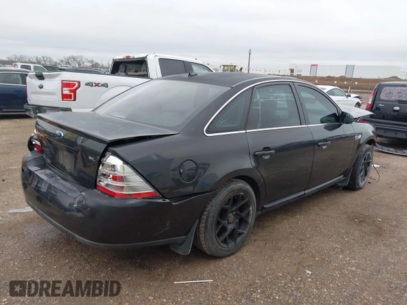 2008 Ford Taurus SEL with VIN 1FAHP24W28G108122, listed as a IAAI auction lot 41546652 with 219,774 mi miles. Bid and sale history available at carsss.com. Image 4.