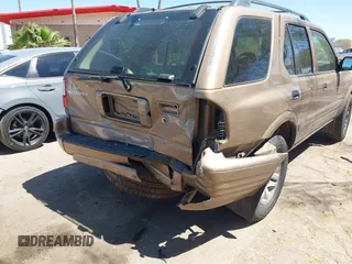 2002 Isuzu Rodeo S z VIN 4S2CK58W024305673, wystawiony jako IAAI lot #42205119 z przebiegiem Nie podano mil oraz . Historia ofert i sprzedaży dostępna na DreamBid. Obrazek 6.