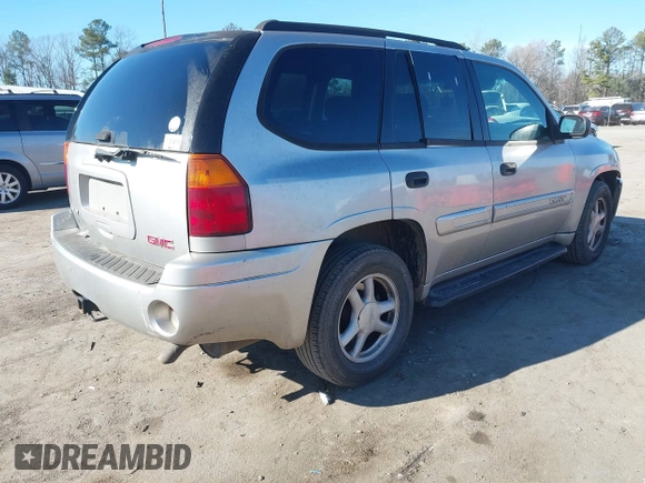 2004 GMC Envoy SLE with VIN 1GKDT13S642213710, listed as a IAAI auction lot 41680656 with 239,187 mi miles. Bid and sale history available at carsss.com. Image 4.