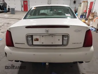 2003 Cadillac DeVille with VIN 1G6KD54Y63U178022, listed as a IAAI auction lot 42076667 with 141,863 mi miles. Bid and sale history available at carsss.com. Image 16.