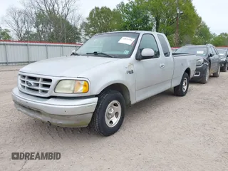 2002 Ford F-150 XL with VIN 1FTRX17282NA84011, listed as a IAAI auction lot 41871210 with 1 mi miles. Bid and sale history available at carsss.com. Image 2.