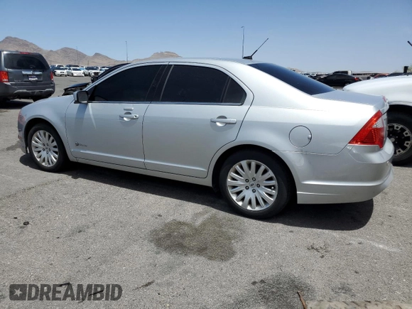 2010 Ford Fusion Hybrid z VIN 3FADP0L39AR273836, wystawiony jako Copart lot #54815095 z przebiegiem 245 960 mil mil oraz Czysty tytuł • Clean title. Historia ofert i sprzedaży dostępna na DreamBid. Obrazek 2.
