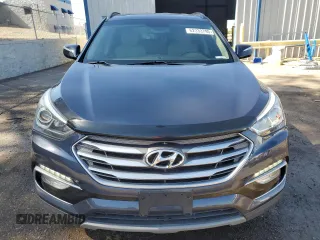 2018 Hyundai Santa Fe 2.4L с VIN 5NMZUDLB6JH097285, выставлен на аукционе Copart как лот 62333795 с пробегом 90 476 миль миль и Списание • Salvage title. История ставок и продаж доступна на DreamBid. Изображение 5.
