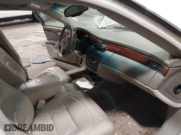 2003 Cadillac DeVille with VIN 1G6KD54Y63U178022, listed as a IAAI auction lot 42076667 with 141,863 mi miles. Bid and sale history available at carsss.com. Image 5.
