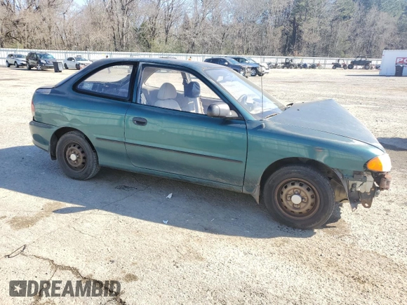 1999 Hyundai Accent z VIN KMHVD14N4XU456698, wystawiony jako Copart lot #41733345 z przebiegiem 197 574 mil mil oraz Szkody całkowita. Historia ofert i sprzedaży dostępna na DreamBid. Obrazek 4.