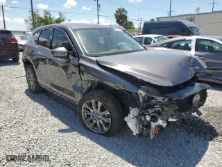 2021 Mazda CX-5 Grand Touring with VIN JM3KFADMXM1300565, listed as a Copart auction lot 53003705 with 40,911 mi miles and Non Repairable. Bid and sale history available at carsss.com. Image 4.