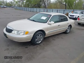 2001 Lincoln Continental with VIN 1LNHM97V51Y602324, listed as a IAAI auction lot 42053789 with 192,221 mi miles. Bid and sale history available at carsss.com. Image 2.