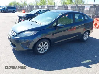 2011 Ford Fiesta SE with VIN 3FADP4BJ7BM135864, listed as a IAAI auction lot 42134479 with 118,573 mi miles. Bid and sale history available at carsss.com. Image 2.
