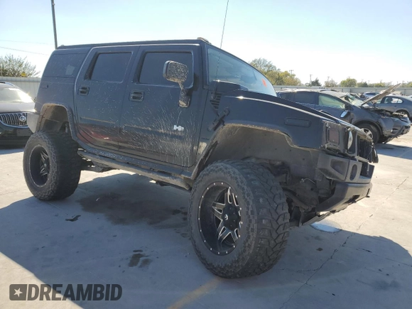 2005 Hummer H2 SUV with VIN 5GRGN23U95H101796, listed as a Copart auction lot 76991574 with 88,204 mi miles and Salvage Title. Bid and sale history available at carsss.com. Image 4.