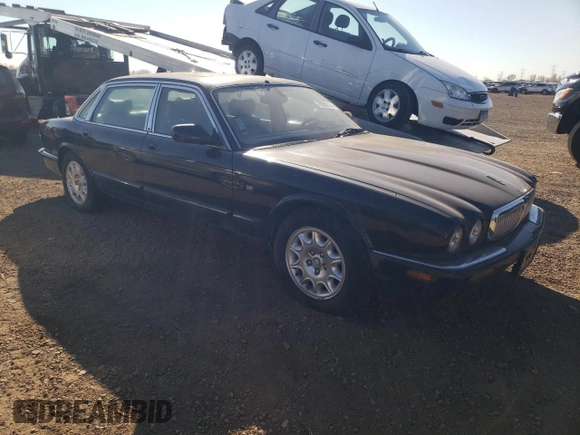 2001 Jaguar XJ with VIN SAJDA23C31LF28667, listed as a Copart auction lot 76983144 with 87,542 mi miles and Clean title. Bid and sale history available at DreamBid. Image 4.