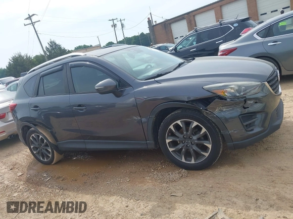 2016 Mazda CX-5 Grand Touring z VIN JM3KE2DY5G0801238, wystawiony jako IAAI lot #42264694 z przebiegiem 136 993 mil mil oraz . Historia ofert i sprzedaży dostępna na DreamBid. Obrazek 12.
