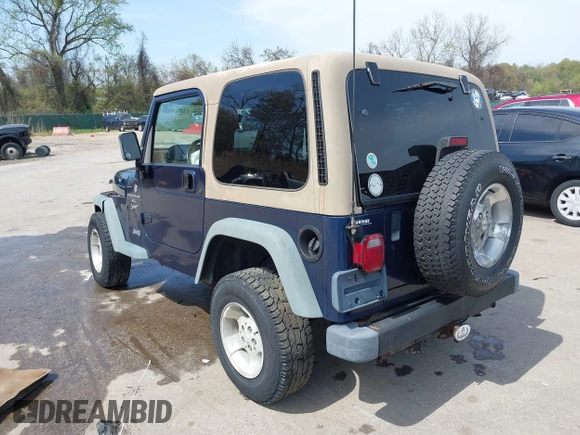 2000 Jeep Wrangler Sport with VIN 1J4FA49S5YP750123, listed as a IAAI auction lot 42060009 with Not Provided miles. Bid and sale history available at carsss.com. Image 3.