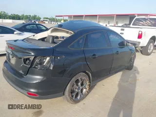 2013 Ford Focus SE z VIN 1FADP3F20DL361861, wystawiony jako IAAI lot #42652227 z przebiegiem 104 502 mil mil oraz . Historia ofert i sprzedaży dostępna na DreamBid. Obrazek 4.