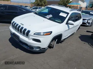 2016 Jeep Cherokee High Altitude with VIN 1C4PJLDB0GW249558, listed as a IAAI auction lot 41851549 with 128,638 mi miles. Bid and sale history available at carsss.com. Image 2.