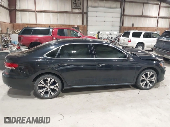 2021 Volkswagen Passat SE z VIN 1VWSA7A39MC001401, wystawiony jako IAAI lot #42019308 z przebiegiem 82 203 mil mil oraz . Historia ofert i sprzedaży dostępna na DreamBid. Obrazek 13.