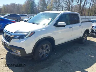 2020 Honda Ridgeline RTL-E with VIN 5FPYK3F75LB000317, listed as a IAAI auction lot 41850029 with 17,430 mi miles and . Bid and sale history available at DreamBid. Image 18.