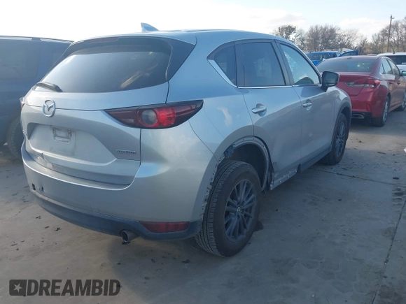 2020 Mazda CX-5 Touring with VIN JM3KFACMXL1786200, listed as a IAAI auction lot 41506139 with 121,944 mi miles. Bid and sale history available at carsss.com. Image 4.