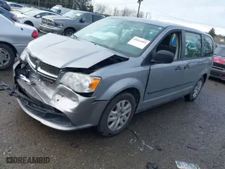 2014 Dodge Grand Caravan SE with VIN 2C4RDGBG7ER131079, listed as a IAAI auction lot 41614495 with 122,925 mi miles. Bid and sale history available at carsss.com. Image 2.